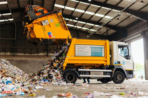 A lorry emptying it's waste